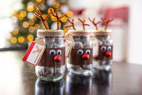 Frooze Balls inside a mason jar decorated as Rudolph the Red-Nosed Reindeer